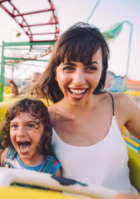 Mother and daughter riding a roller coaster