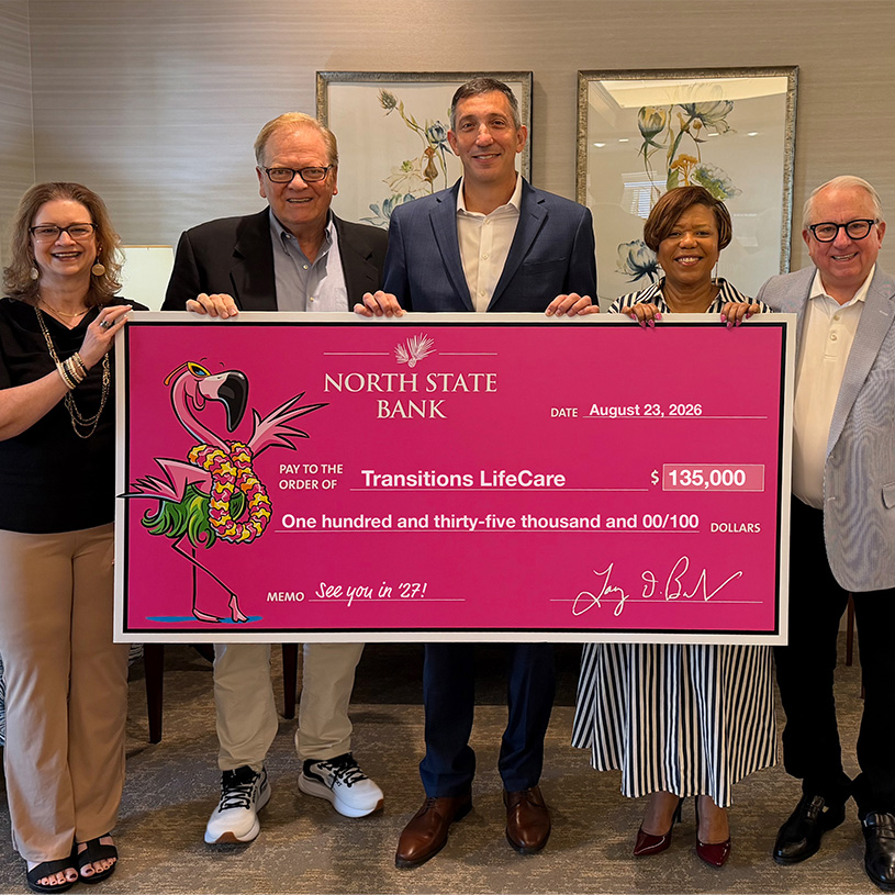 North State Bank team holding donation check for Transitions LifeCare