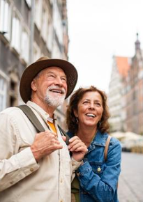 Smiling couple outside in city