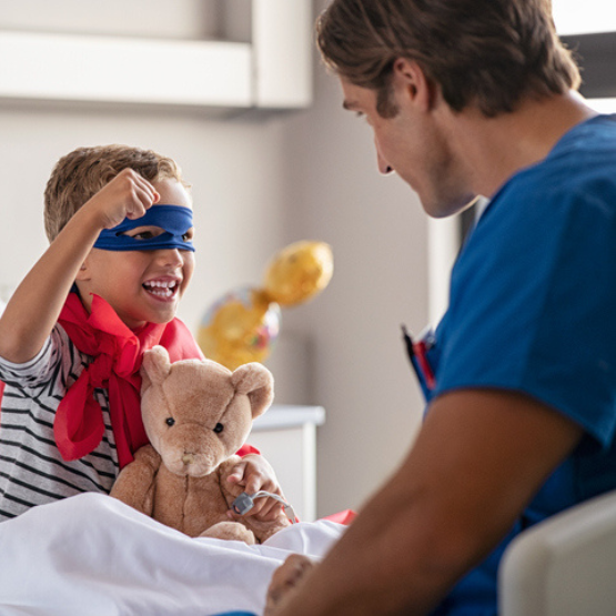 Child in costume with doctor in doctor's office