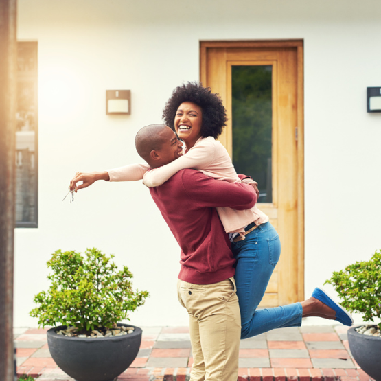 Couple hugging on porch