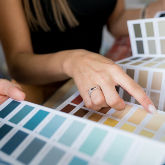 Person selecting paint colors
