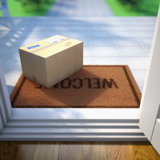 Package on welcome mat at front door
