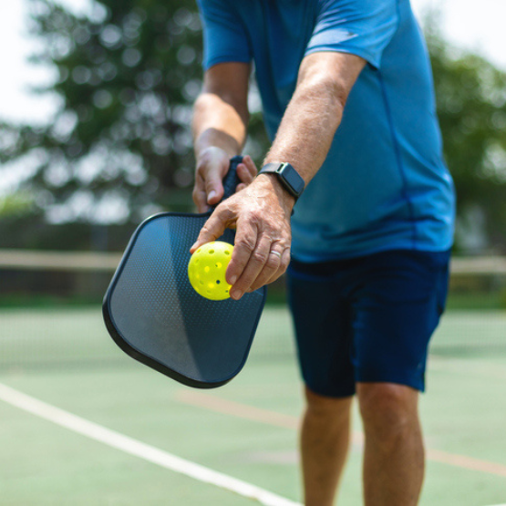 Person playing pickle ball