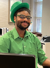 Employee dressed for St. Patrick's Day