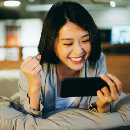 Smiling woman holding cell phone